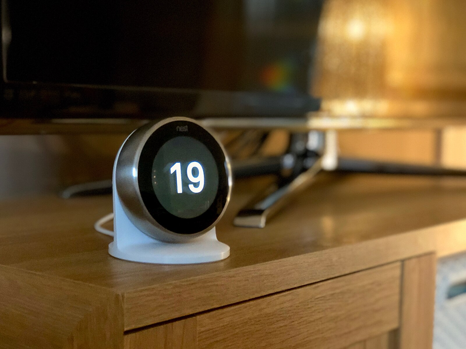 Smart thermostat with circular display installed in a Bedfordshire living room — smart heating upgrade by On-Tap Plumbing & Heating